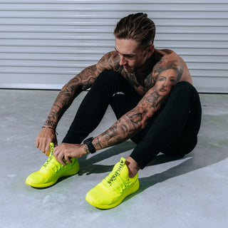 yellow sneakers men with model covered in hair gel